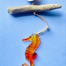 Red  seahorse decoration made of fused glass hanging sun catcher from driftwood 