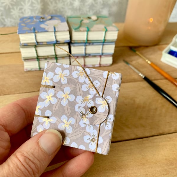 Coptic Bound Tiny Floral Watercolour Sketchbook. Beige, white and gold.
