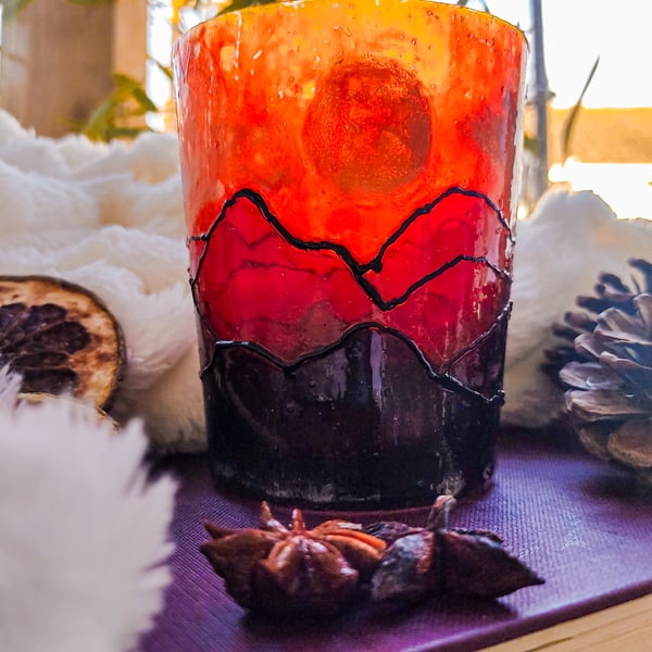 Handmade stained glass effect lantern candleholder with sunset over mountains