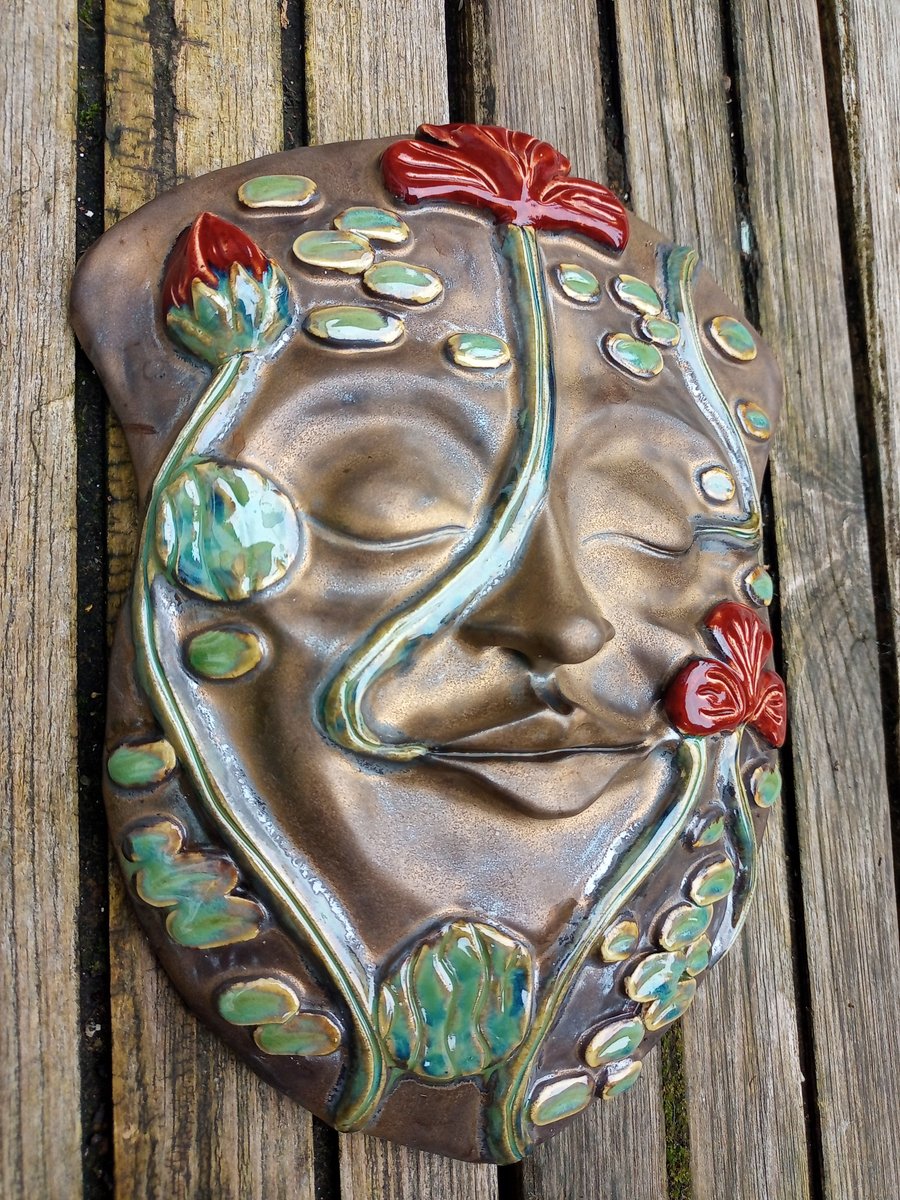Greenman with red flowers