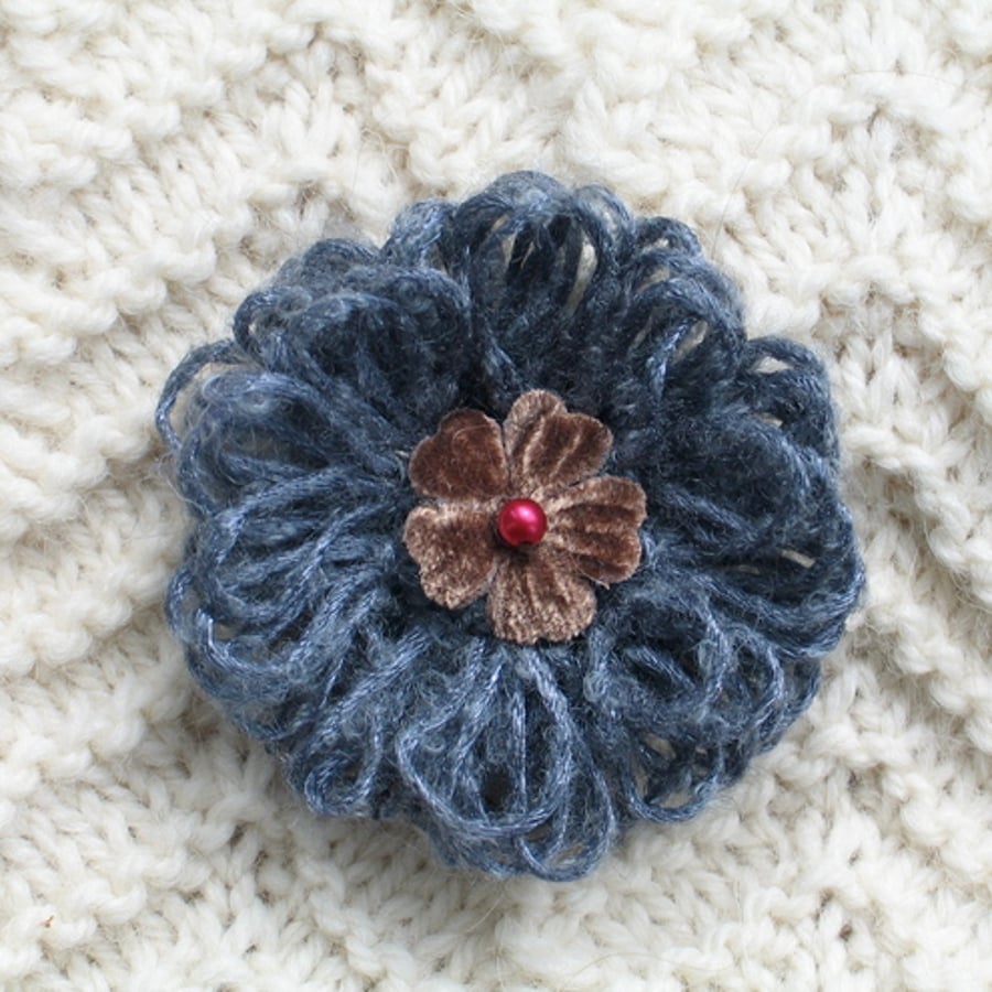 silver and brown brooch