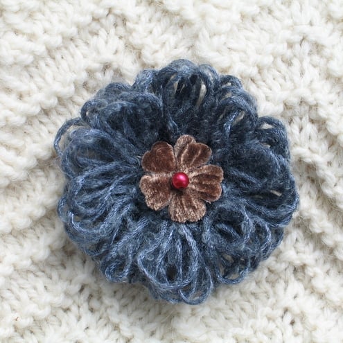 silver and brown brooch