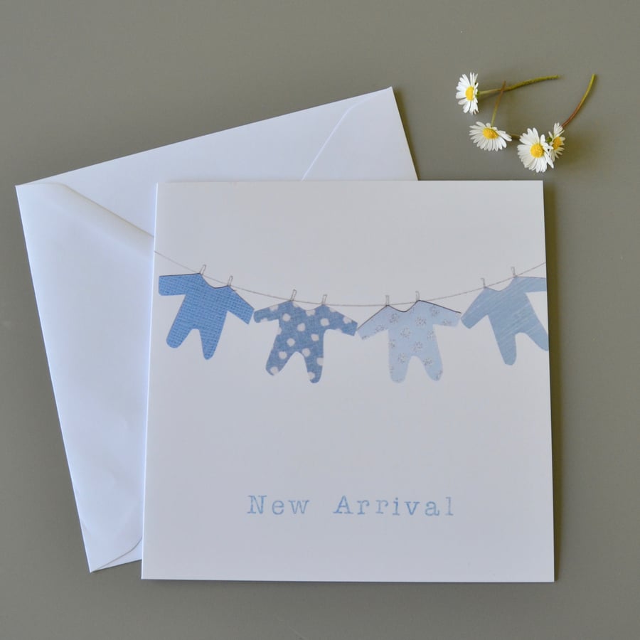 New Baby Boy 'New Arrival' Card with washing line of blue babygros