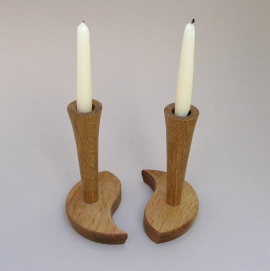 A pair of oak candlesticks