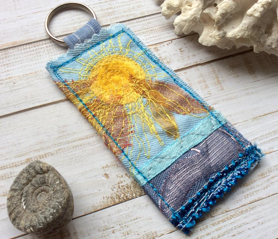 Up-cycled embroidered sun keyring or bag charm. 