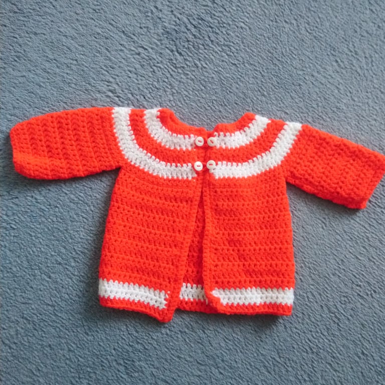 Red and white crochet newborn baby cardigan. Great for a Christmas baby! 