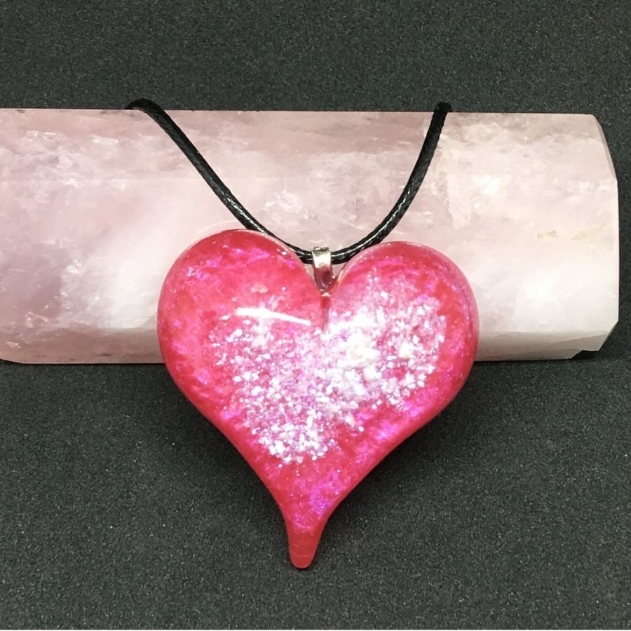 Red sparkly puffy heart statement pendant with black cord chain.