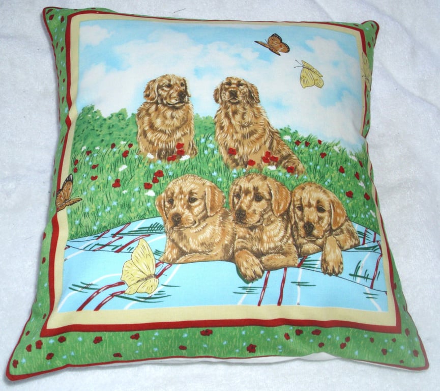 Golden Retrievers and pups in the garden cushion
