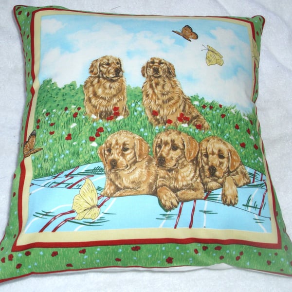 Golden Retrievers and pups in the garden cushion