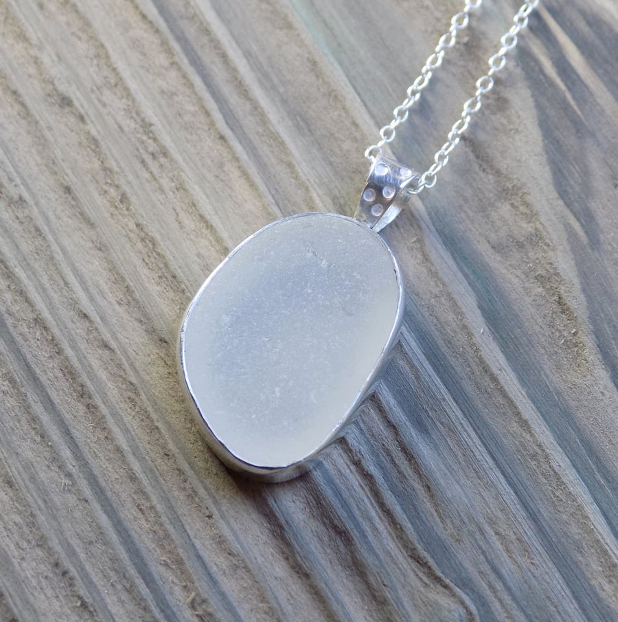 Sea glass and sterling silver bezel set pendant