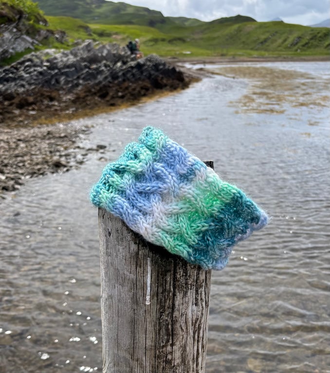 Hand knitted, lined headband featuring Celtic knot pattern 