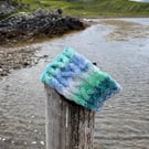 Hand knitted, lined headband featuring Celtic knot pattern 