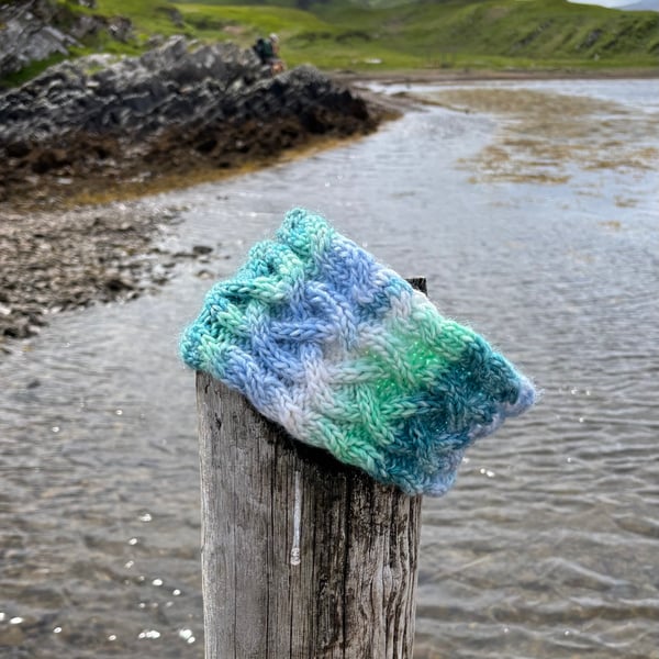 Hand knitted, lined headband featuring Celtic knot pattern 