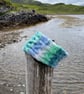 Hand knitted, lined headband featuring Celtic knot pattern 