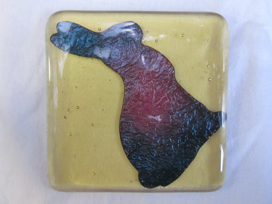 Handmade fused glass coaster - copper bunny on amber tint