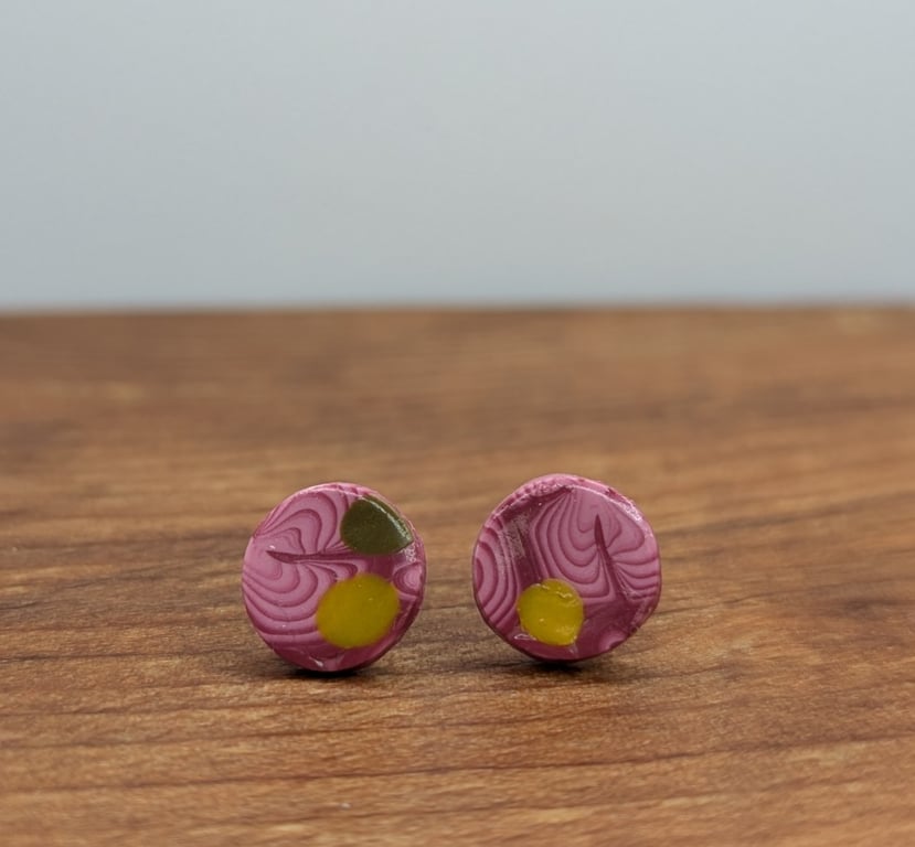 Swirly pink with yellow and green detail studs