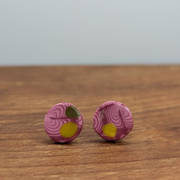 Swirly pink with yellow and green detail studs