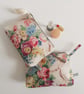 Make up cosmetics or toiletries bag upcycled in a vintage roses print fabric
