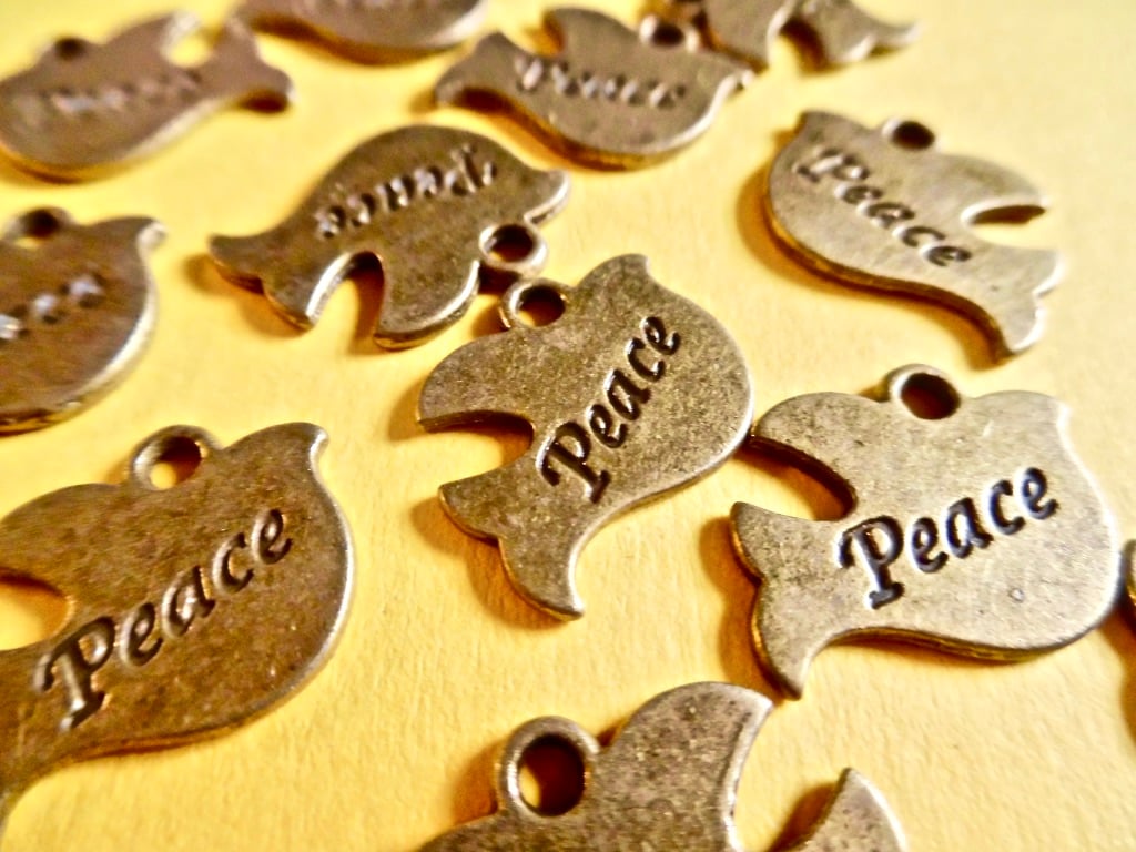 15 x Bronze Tone Dove with 'peace' engraving charms 