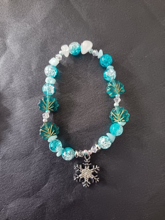 Elasticated winter beaded bracelet with crystal chip and snowflake charm