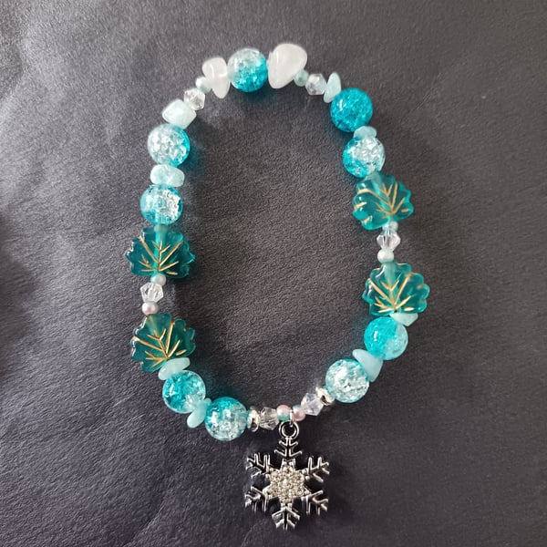 Elasticated winter beaded bracelet with crystal chip and snowflake charm