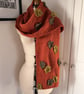 Hand knitted scarf with leaf details