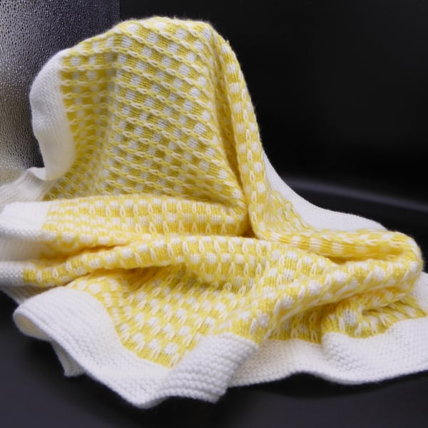White and yellow double knit pram blanket
