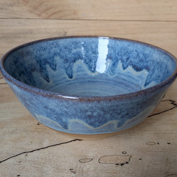 Medium to large sized pale blue wavy toasted bowl