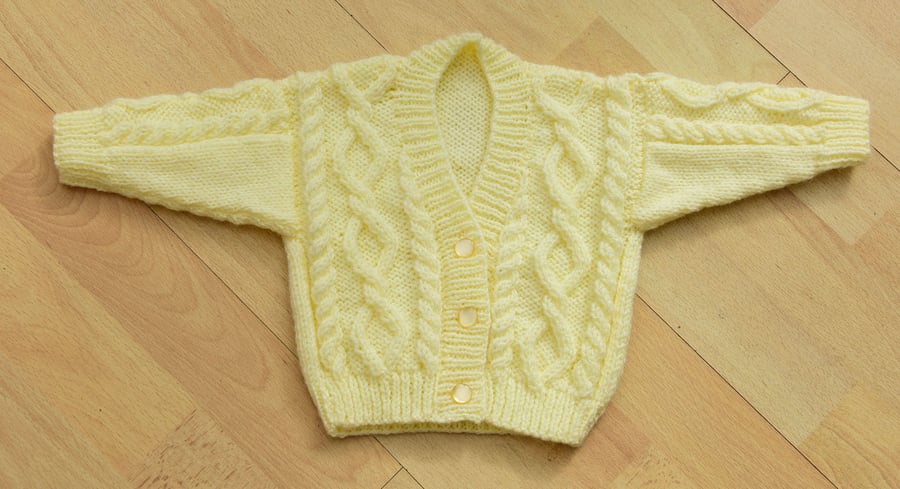 babies hand knitted cardigan in pale lemon to fit newborn to 6 months approxr