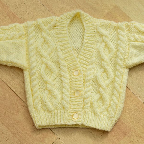 babies hand knitted cardigan in pale lemon to fit newborn to 6 months approxr