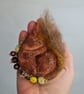 Handmade sleepy squirrel soft sculpture textile art.