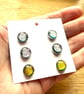 Card of six dichroic fused glass cabachons