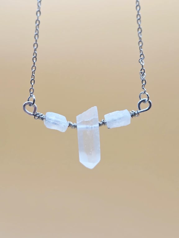 Necklace with wire wrapped clear quartz crystal pendant
