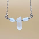 Necklace with wire wrapped clear quartz crystal pendant