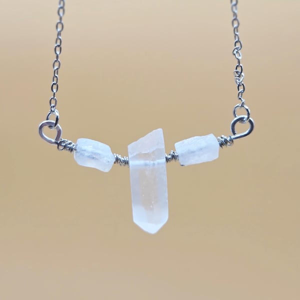 Necklace with wire wrapped clear quartz crystal pendant