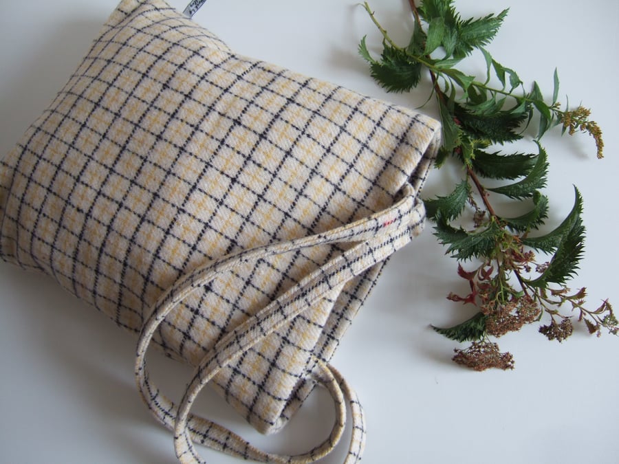 Woollen tote bag in a cream and beige checked design.