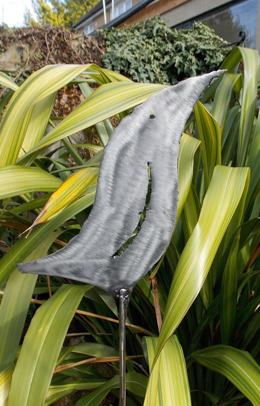 Polished steel, sculptured bird plant support, 110cm approx.