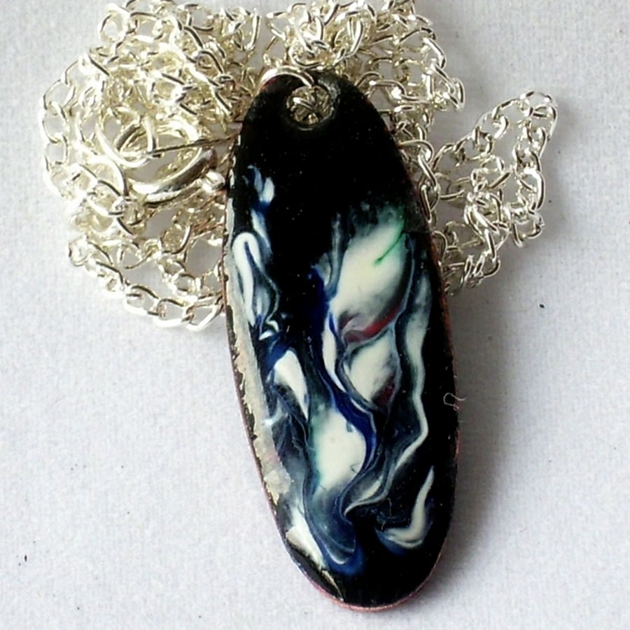 pendant: small oval  scrolled white on dark blue over clear enamel
