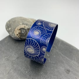 Navy blue anodised aluminium ‘ammonite’ cuff