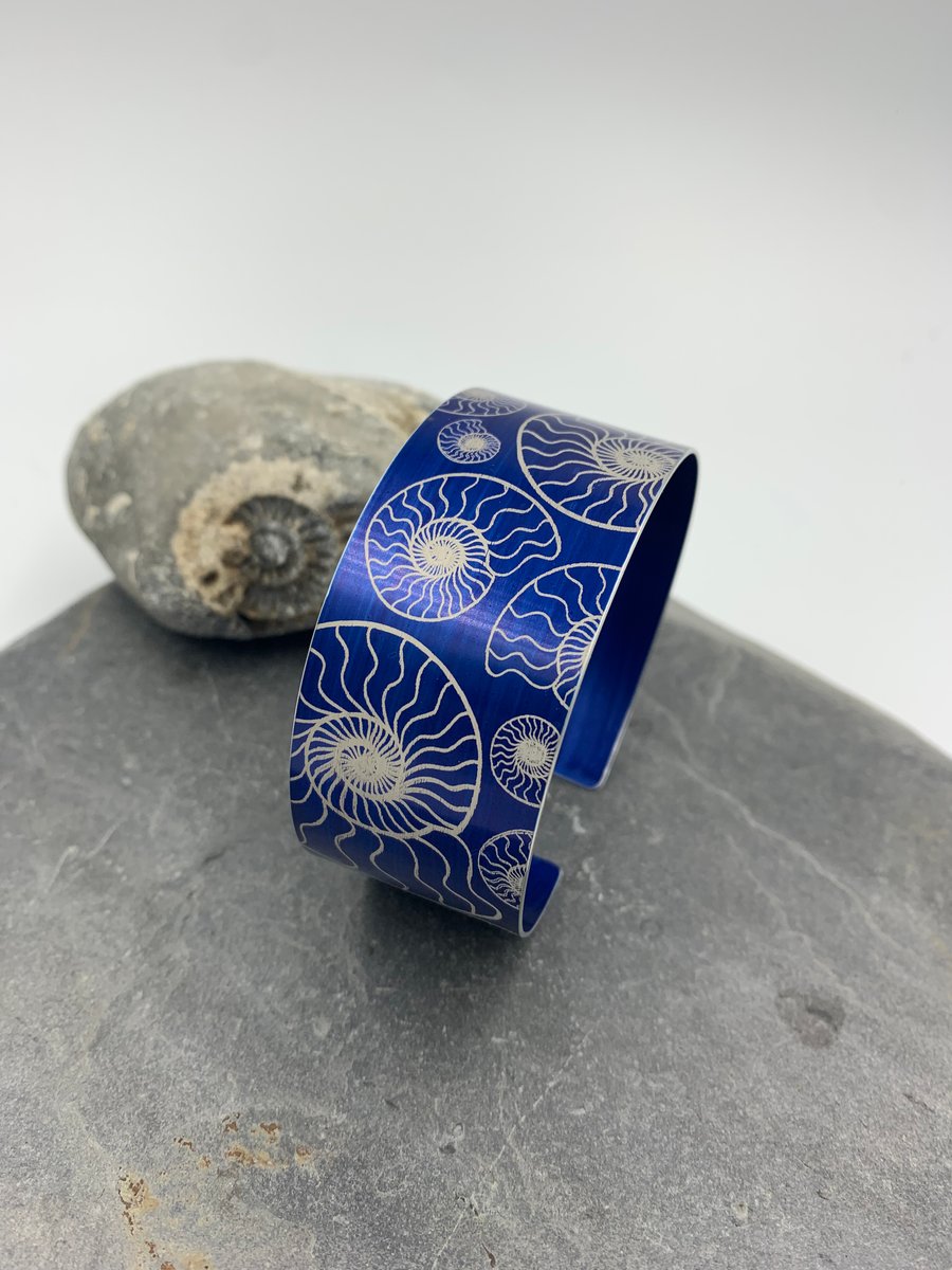 Navy blue anodised aluminium ‘ammonite’ cuff
