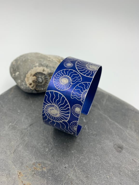 Navy blue anodised aluminium ‘ammonite’ cuff
