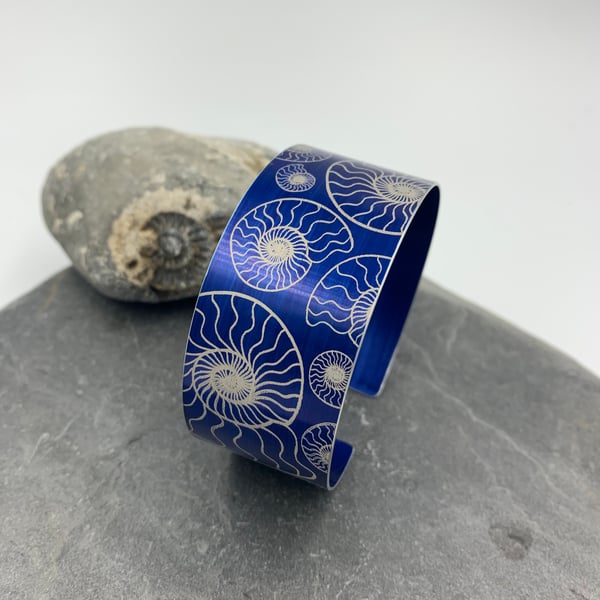 Navy blue anodised aluminium ‘ammonite’ cuff