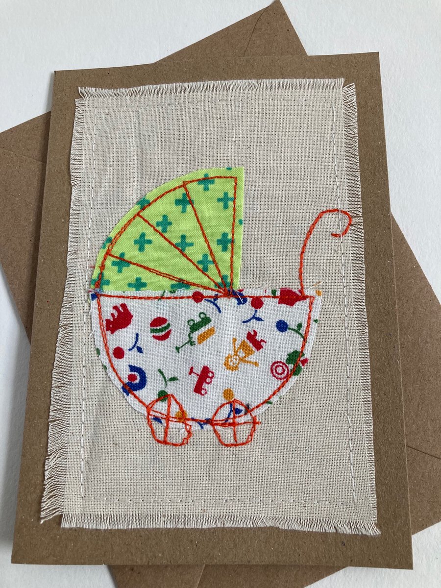 Appliqué sewn new baby card. Green and orange