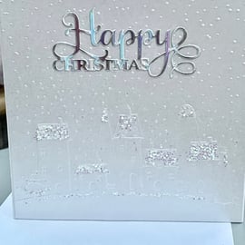 Snowy village scene embossed and glittered Christmas card