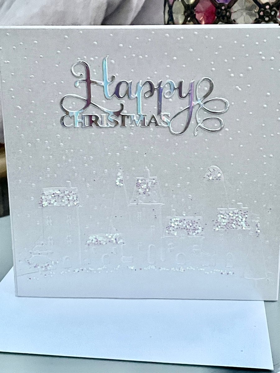 Snowy village scene embossed and glittered Christmas card