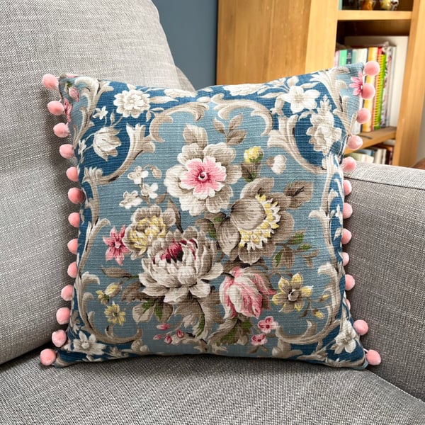 Vintage floral cushion cover with pink pompoms