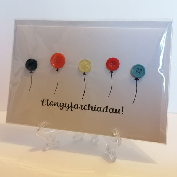Llongyfarchiadau (Congratulations) balloon buttons greetings card Welsh