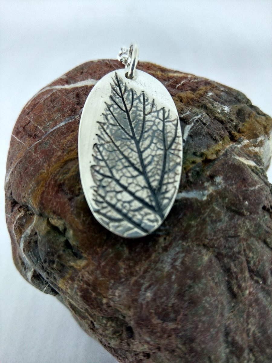 Wild raspberry leaf pendant in fine silver