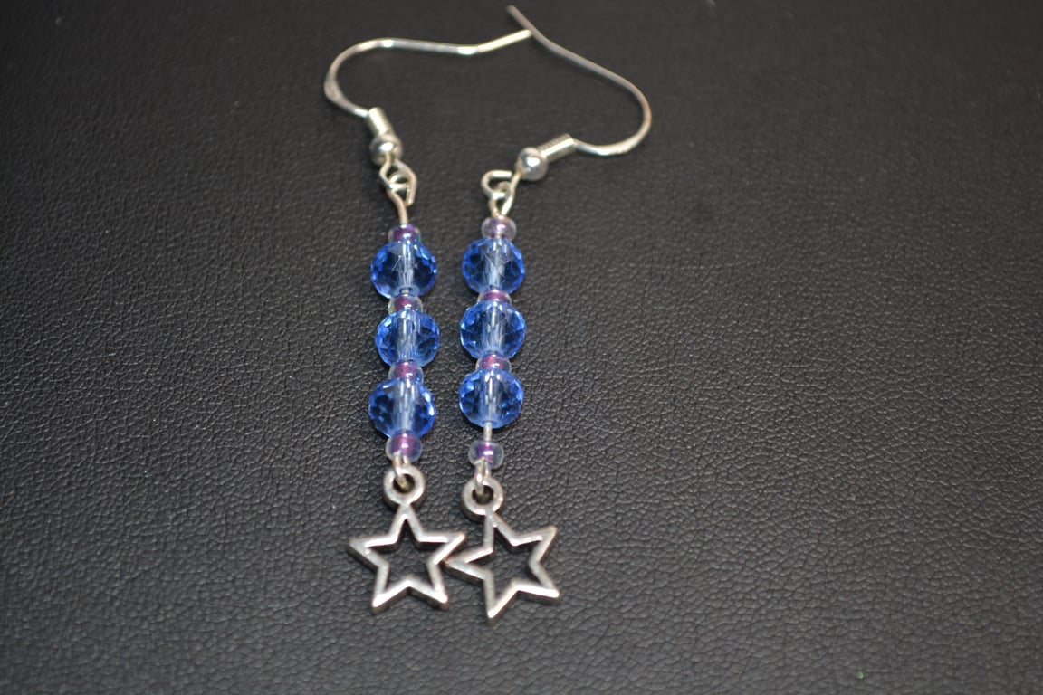 Blue glass beaded earrings with silver metal star charm