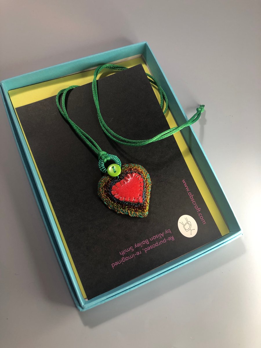 Turquoise edged red rubber and wire heart pendant from recycled materials